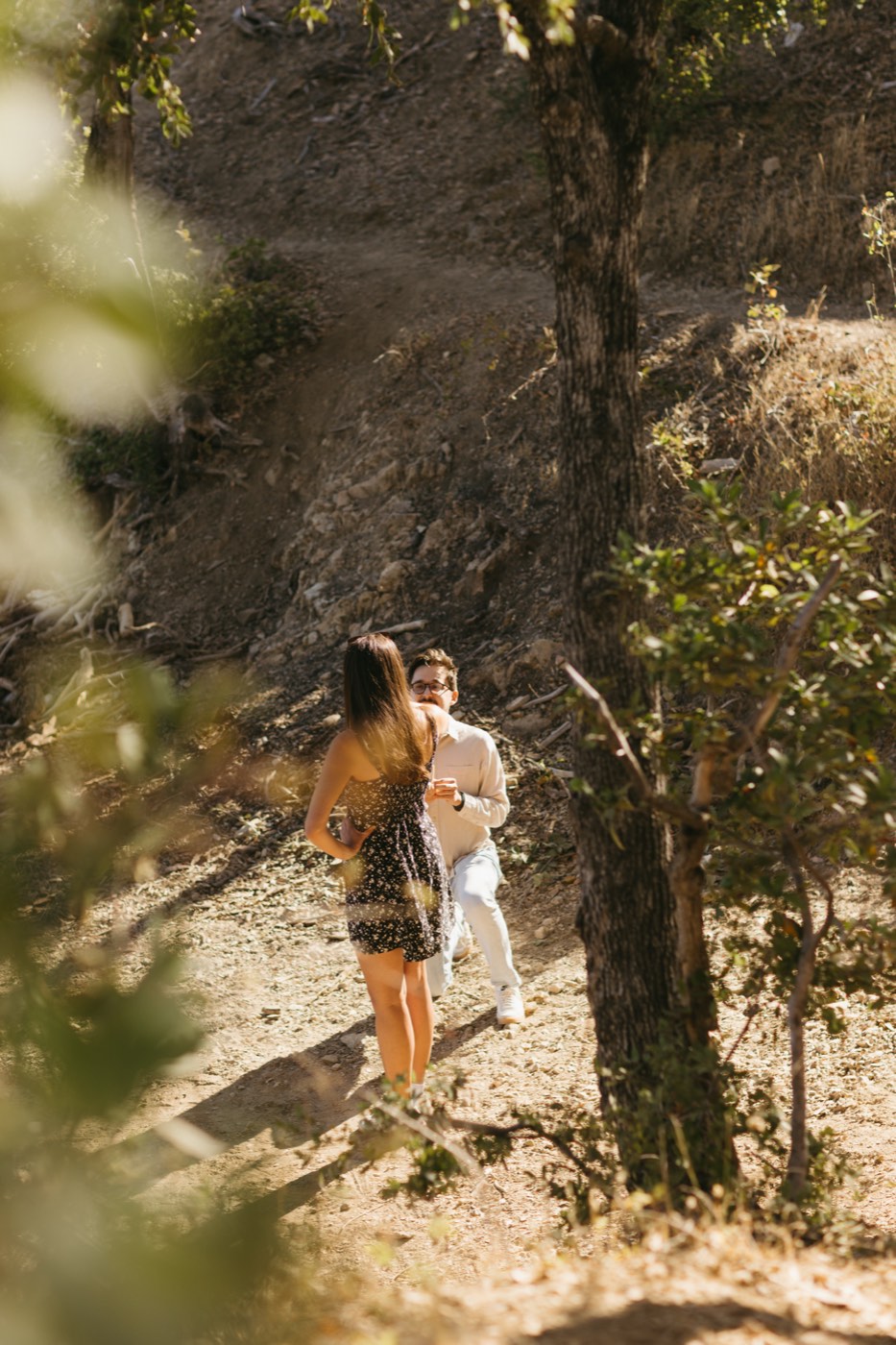 Andrea and Alex climbing the trail through the trees